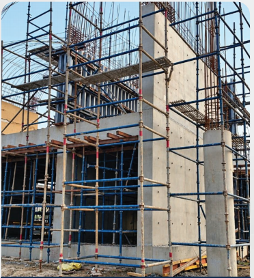 Exposed fair face concrete structure with scaffolding